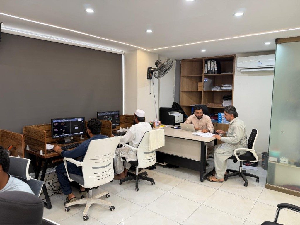 Design studio with CAD workstations and a client meeting desk